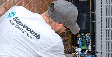 Newcomb and Company HVAC technician providing maintenance services