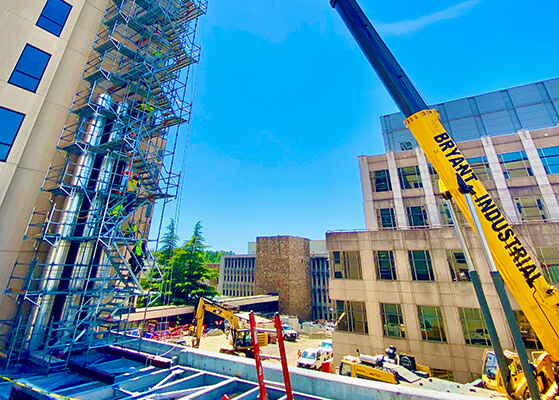 Crane and construction equipment outside of a medical center facility