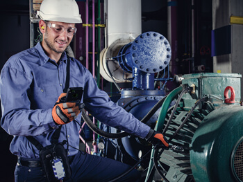 HVAC technician providing HVAC maintenance system